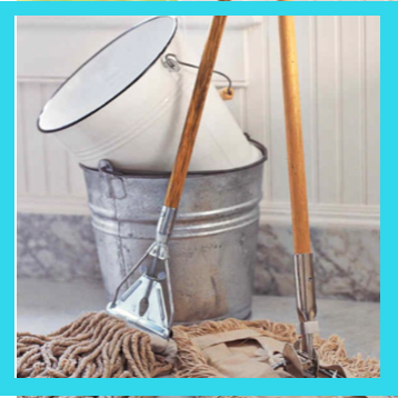 A galvanised mop bucket with a mop and a long-handled scrub brush
