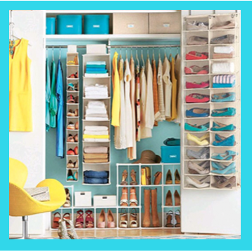 A neatly organised walk-in closet with hanging clothes and stacked shelving